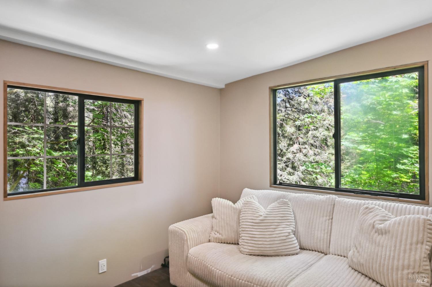 21713 Starrett Hill Drive Monte Rio, CA 95462 - Photo 21 of 50 a living room with furniture and a window