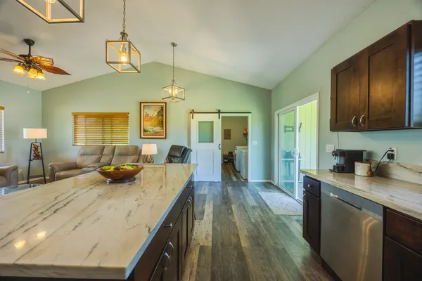 a kitchen with sink and refrigerator