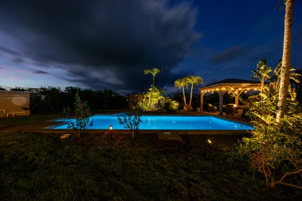 a view of a backyard with chairs