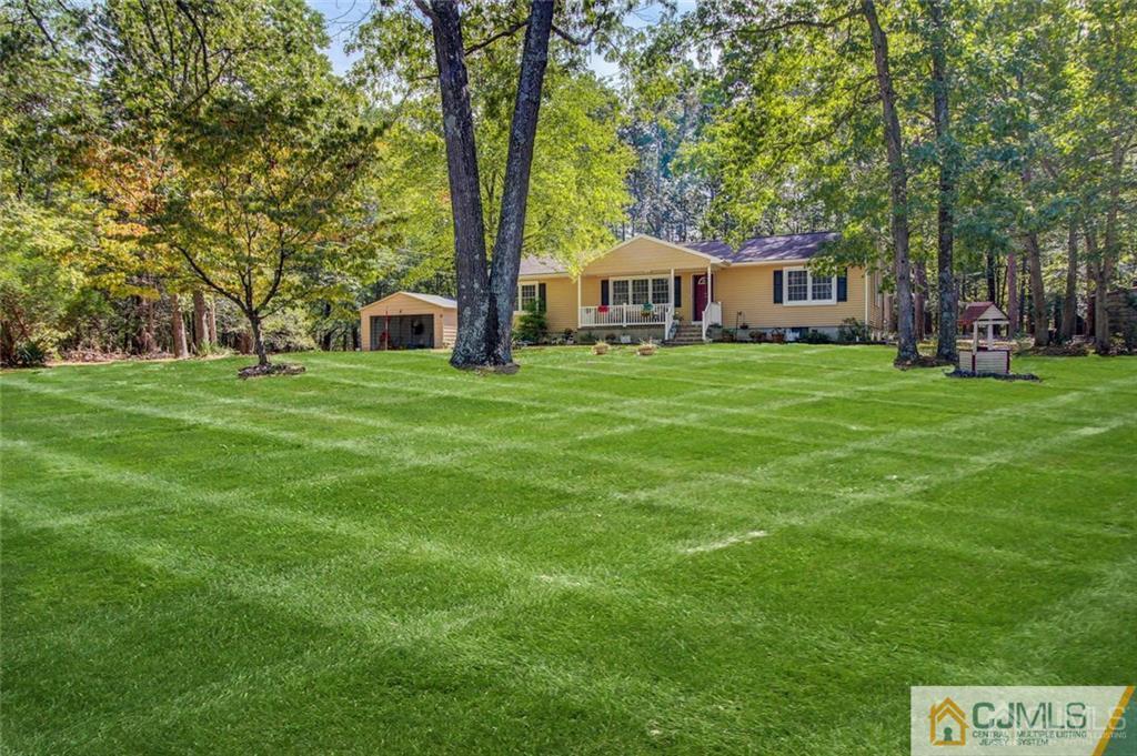 501 Pinehurst Road Cream Ridge, NJ 08514 - Photo 1 of 36 a front view of a house with a garden