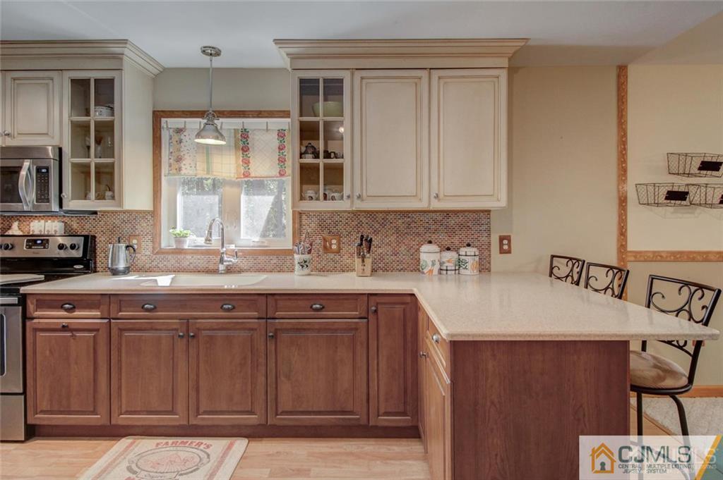 501 Pinehurst Road Cream Ridge, NJ 08514 - Photo 13 of 36 a kitchen with a sink cabinets and window