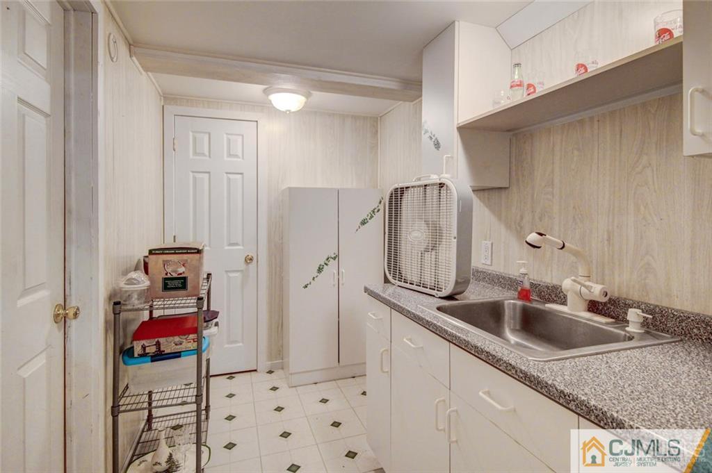 501 Pinehurst Road Cream Ridge, NJ 08514 - Photo 16 of 36 a bathroom with a sink and mirror