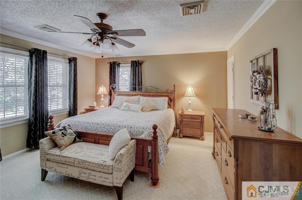 501 Pinehurst Road Cream Ridge, NJ 08514 - Photo 18 of 36 a bedroom with a bed mirror and window
