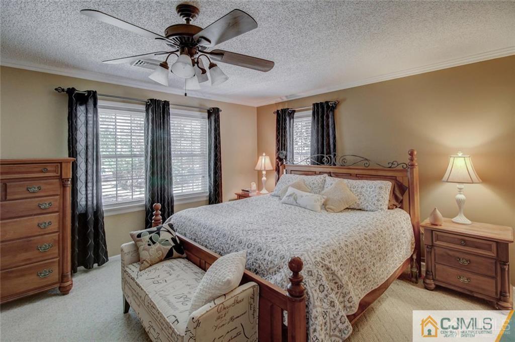 501 Pinehurst Road Cream Ridge, NJ 08514 - Photo 19 of 36 a bedroom with a bed and a dresser