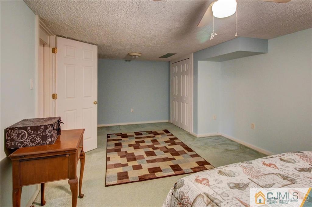 501 Pinehurst Road Cream Ridge, NJ 08514 - Photo 24 of 36 a bedroom with a bed and dresser