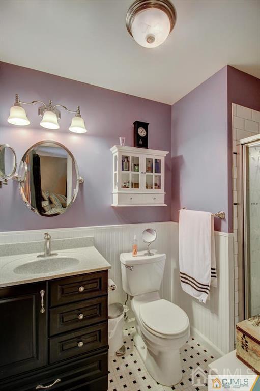 501 Pinehurst Road Cream Ridge, NJ 08514 - Photo 28 of 36 a bathroom with a toilet a sink and a mirror