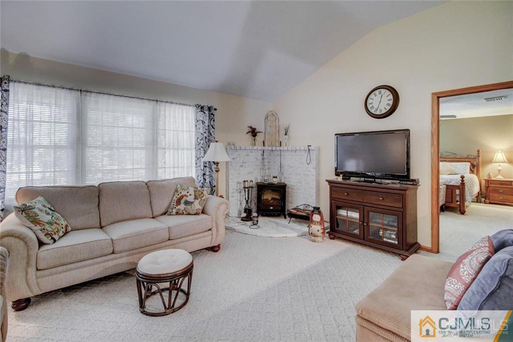 501 Pinehurst Road Cream Ridge, NJ 08514 - Photo 4 of 36 a living room with furniture and a flat screen tv