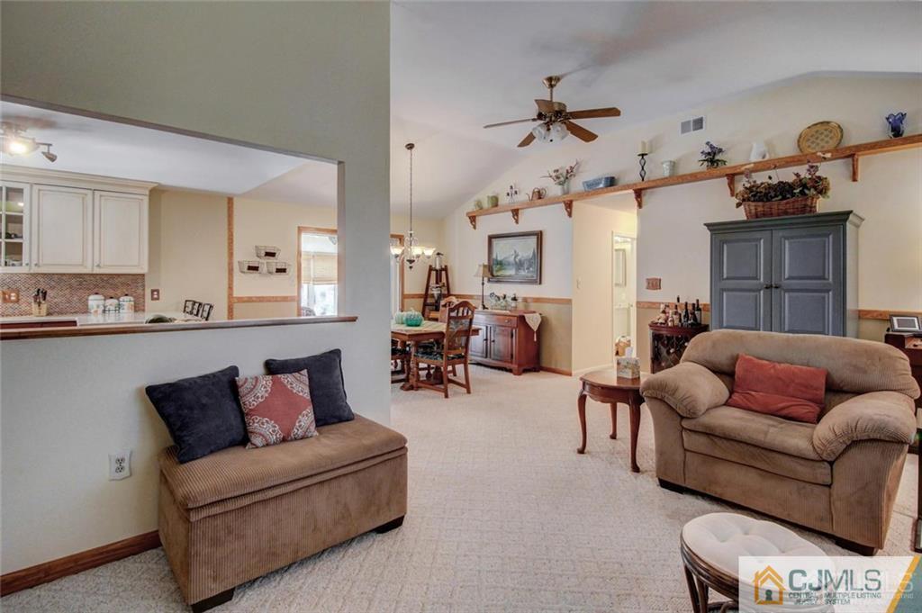 501 Pinehurst Road Cream Ridge, NJ 08514 - Photo 6 of 36 a living room with furniture and a dining table