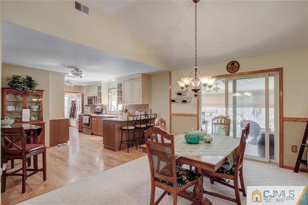 501 Pinehurst Road Cream Ridge, NJ 08514 - Photo 8 of 36 a view of a dining room with furniture window and wooden floor