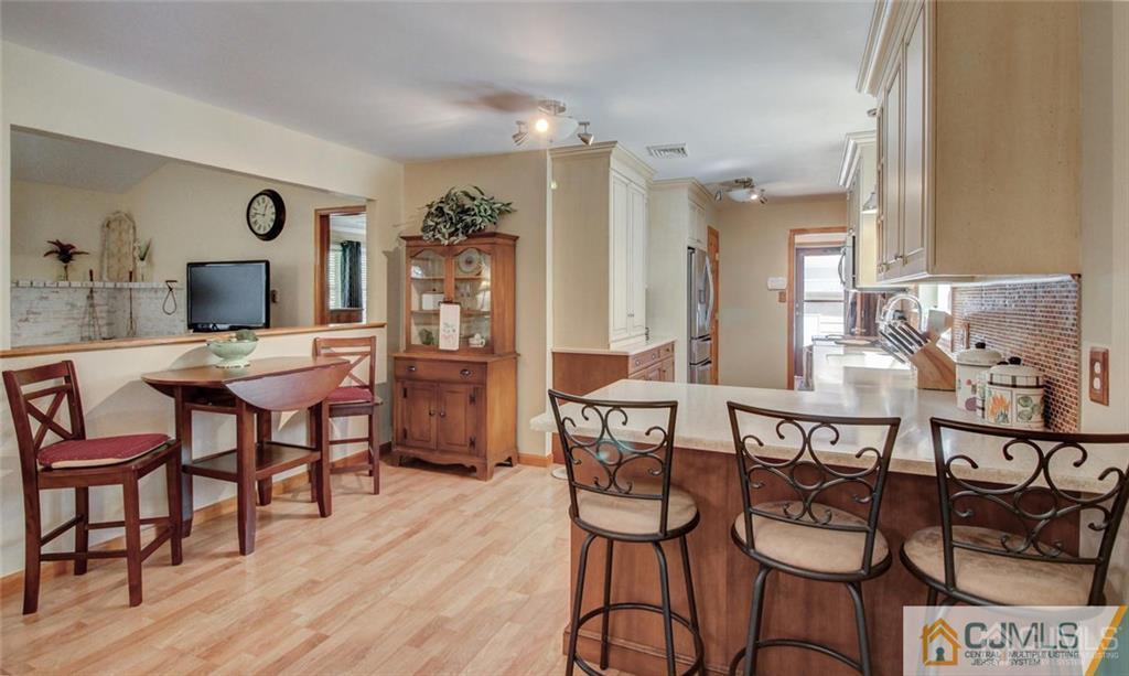 501 Pinehurst Road Cream Ridge, NJ 08514 - Photo 10 of 36 a view of a dining room with furniture and wooden floor