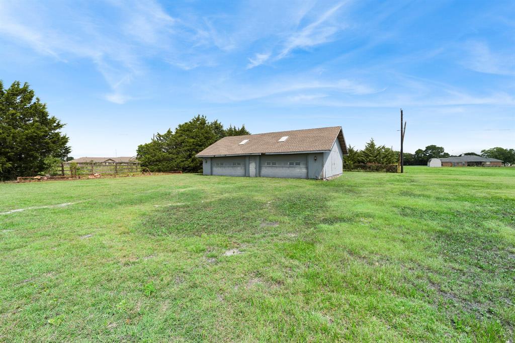 1175 Bloom Street Lucas, TX 75002 - Photo 35 of 36 a backyard of a house with lots of green space and tree