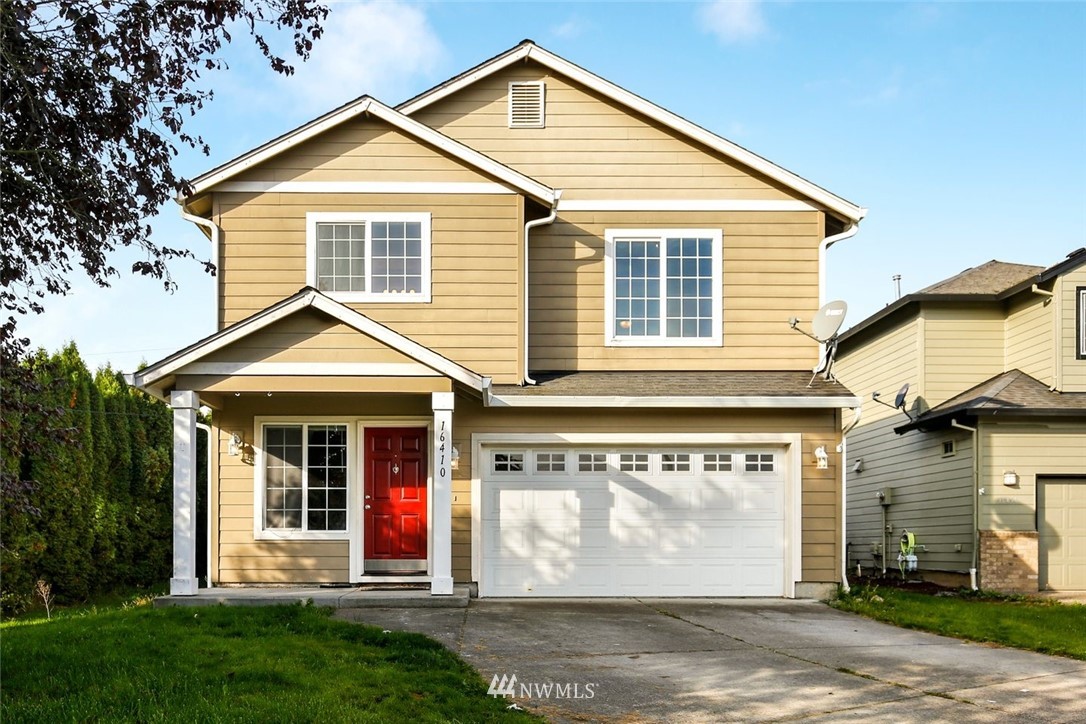 16410 Northeast 12th Court Ridgefield, WA 98642 - Photo 1 of 25 a front view of a house with a yard and porch