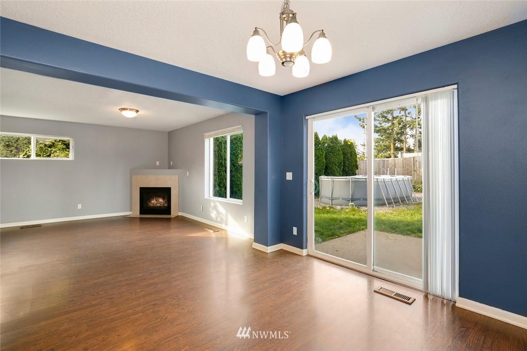 16410 Northeast 12th Court Ridgefield, WA 98642 - Photo 11 of 25 wooden floor in an empty room with a window