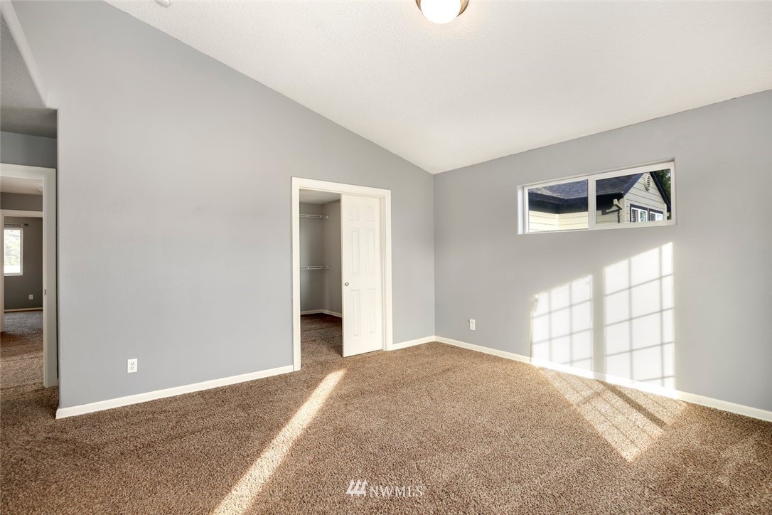 16410 Northeast 12th Court Ridgefield, WA 98642 - Photo 14 of 25 a view of a livingroom with a windows and ceiling fan