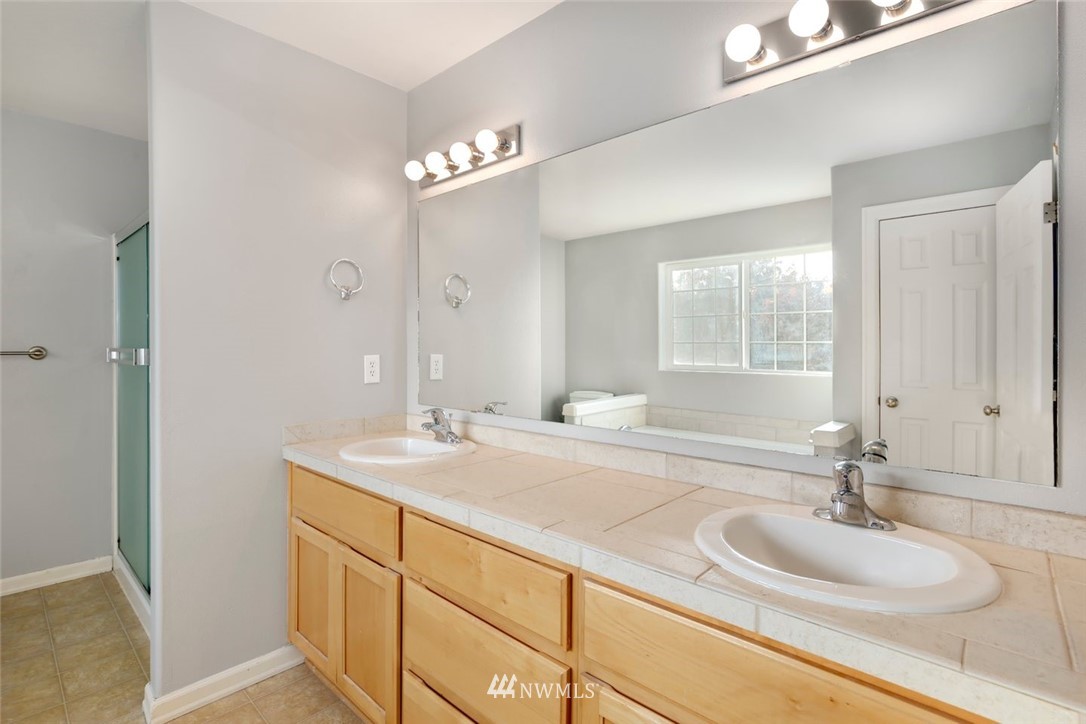 16410 Northeast 12th Court Ridgefield, WA 98642 - Photo 15 of 25 a bathroom with a sink and a mirror