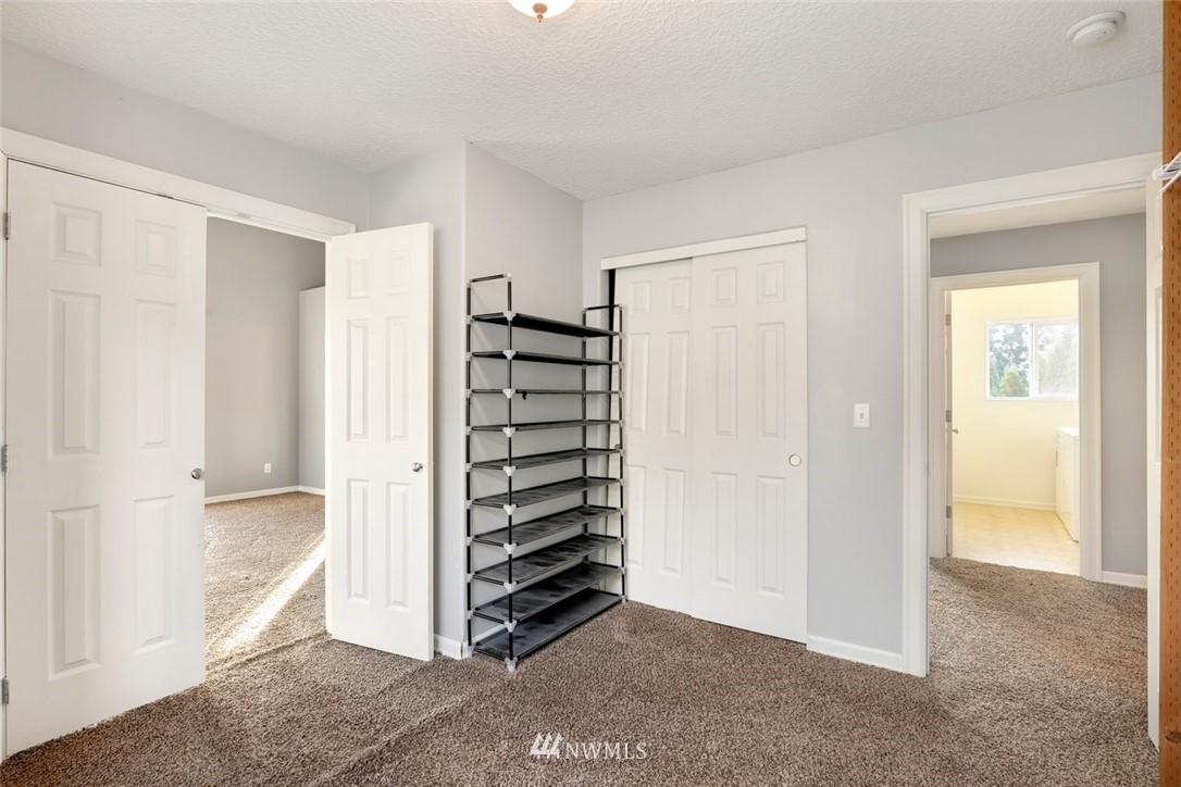 16410 Northeast 12th Court Ridgefield, WA 98642 - Photo 17 of 25 a view of room with staircase and white walls