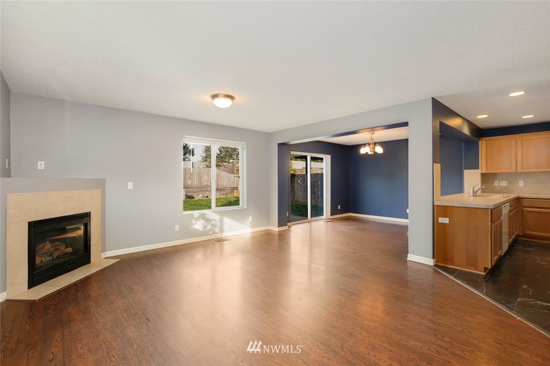 16410 Northeast 12th Court Ridgefield, WA 98642 - Photo 3 of 25 a view of an empty room with a window and fireplace
