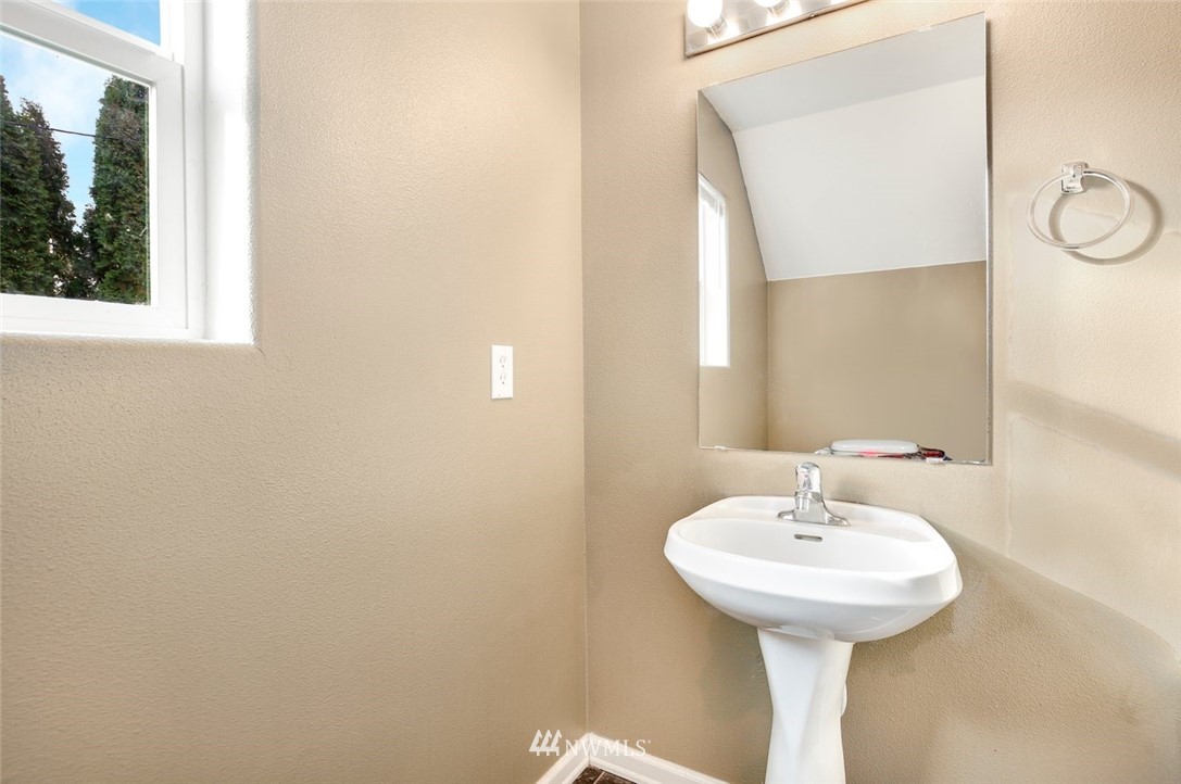 16410 Northeast 12th Court Ridgefield, WA 98642 - Photo 22 of 25 a bathroom with a sink and mirror