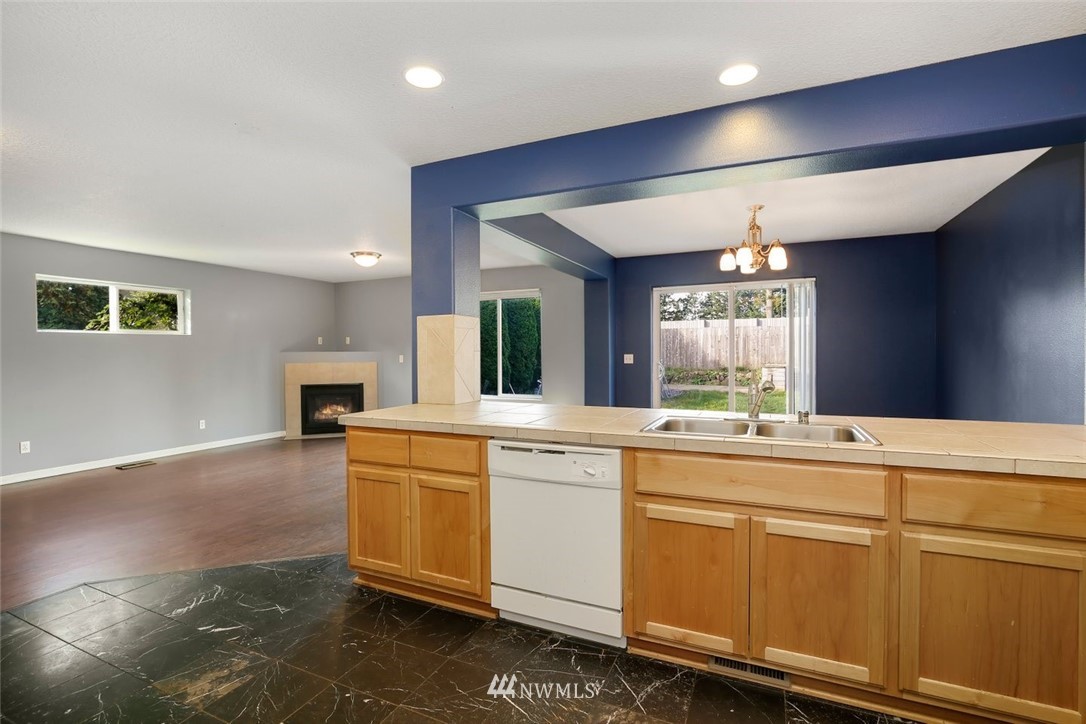 16410 Northeast 12th Court Ridgefield, WA 98642 - Photo 9 of 25 a kitchen with cabinets a sink and appliances