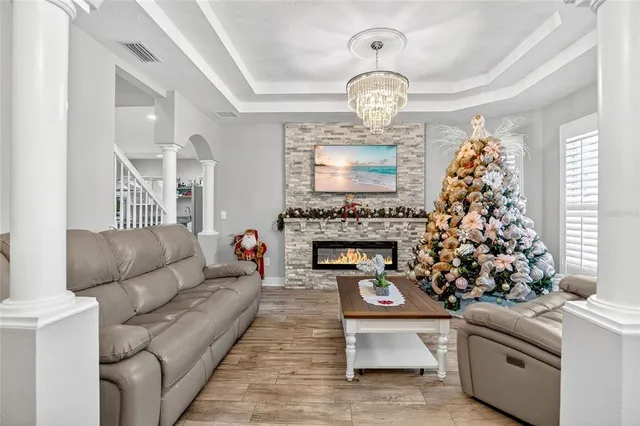 a living room with furniture and a fireplace