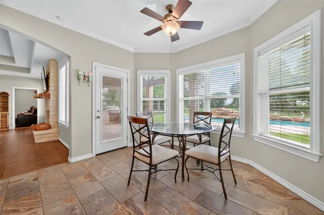 a kitchen with stainless steel appliances kitchen island granite countertop a stove a sink a counter top space and cabinets