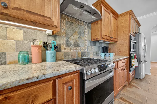 a spacious bedroom with a bed a couch and dresser