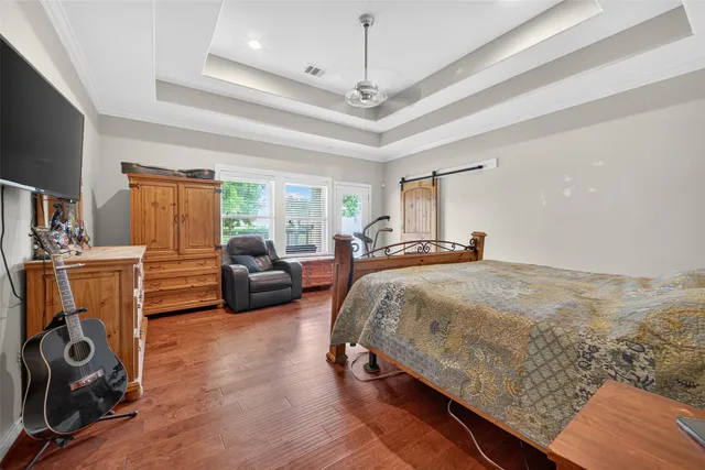 a bathroom with a granite countertop sink and a bathtub