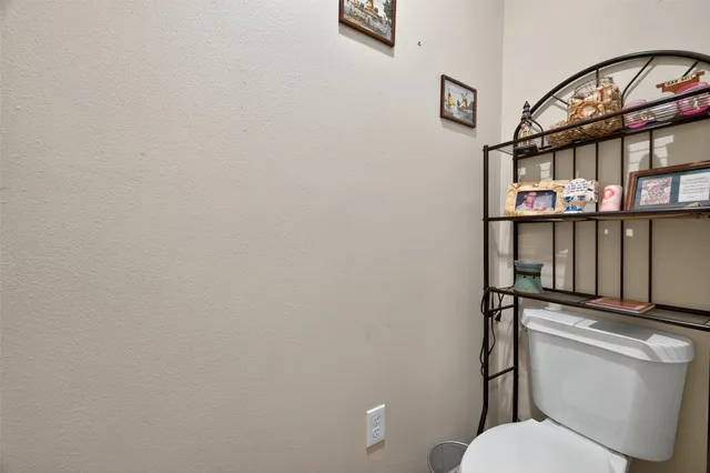 a living room with furniture a ceiling fan and wooden floor