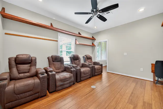 a view of house with garden space and swimming pool