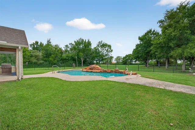 a view of a house with a swimming pool