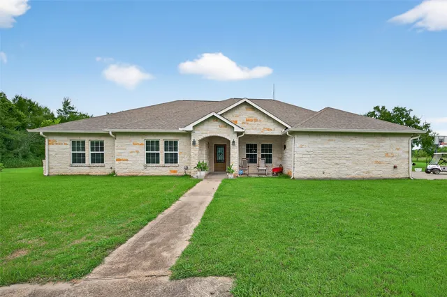 a view of a yard in front of a house with a yard