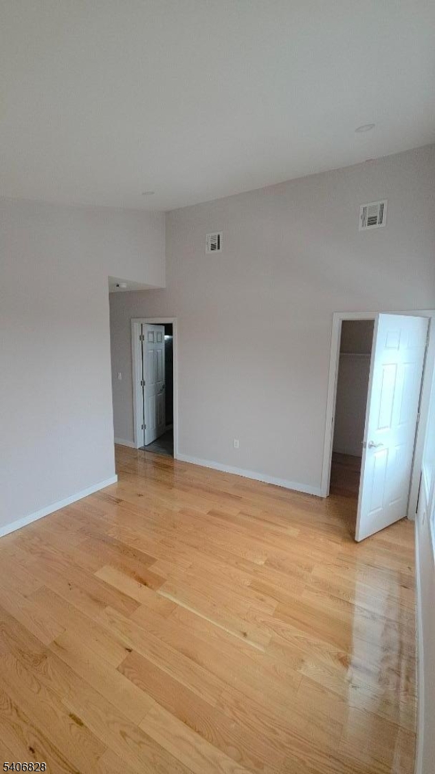 10 Shaw Avenue, Unit 2 Newark, NJ 07112 - Photo 15 of 15 a view of an empty room with wooden floor and closet
