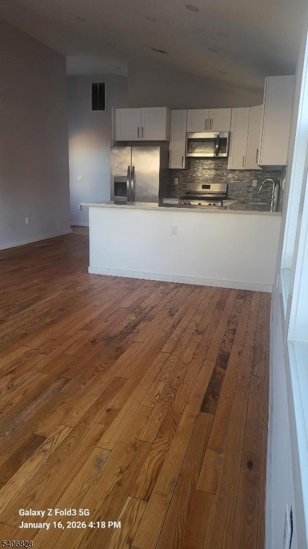 10 Shaw Avenue, Unit 2 Newark, NJ 07112 - Photo 5 of 14 a kitchen with stainless steel appliances a sink a stove top oven a counter space and cabinets