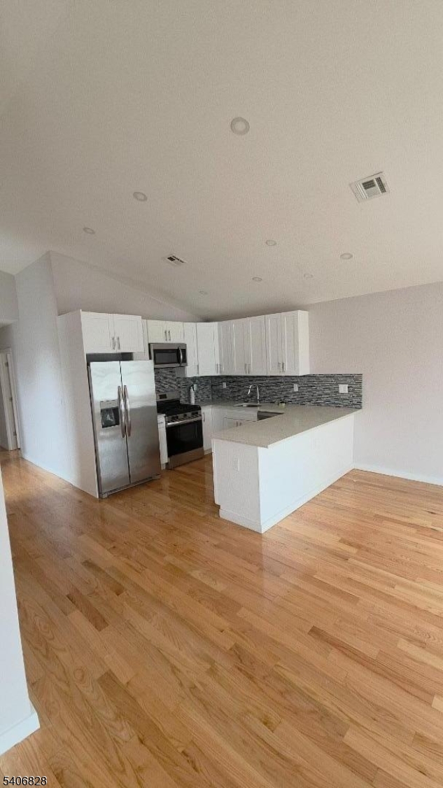 10 Shaw Avenue, Unit 2 Newark, NJ 07112 - Photo 5 of 15 a view of a kitchen with stainless steel appliances granite countertop a stove top oven