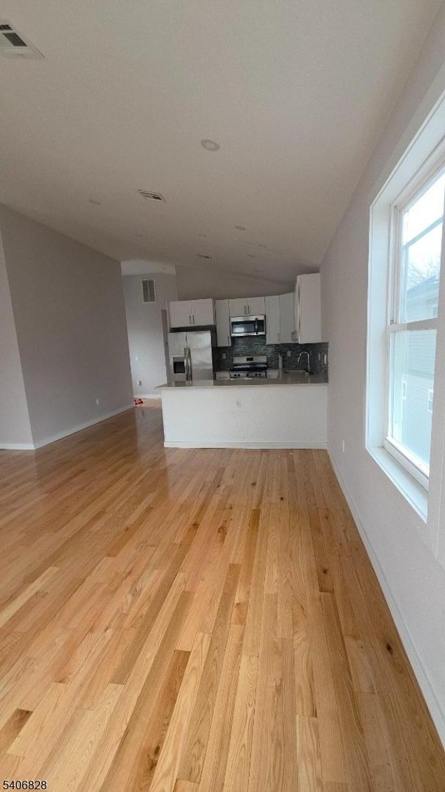 10 Shaw Avenue, Unit 2 Newark, NJ 07112 - Photo 6 of 15 a big room with wooden floor