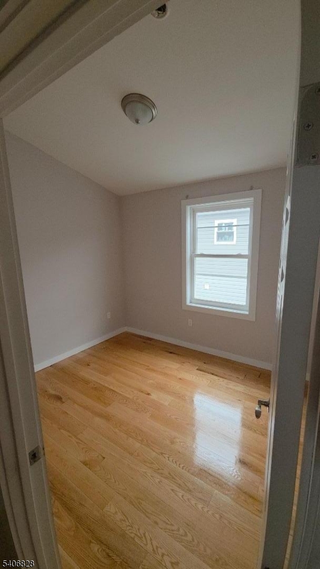 10 Shaw Avenue, Unit 2 Newark, NJ 07112 - Photo 9 of 15 an empty room with a window