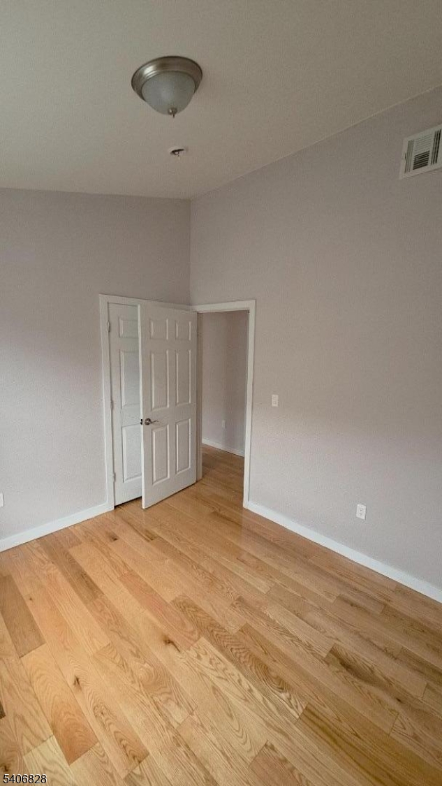 10 Shaw Avenue, Unit 2 Newark, NJ 07112 - Photo 10 of 15 a view of an empty room and wooden floor