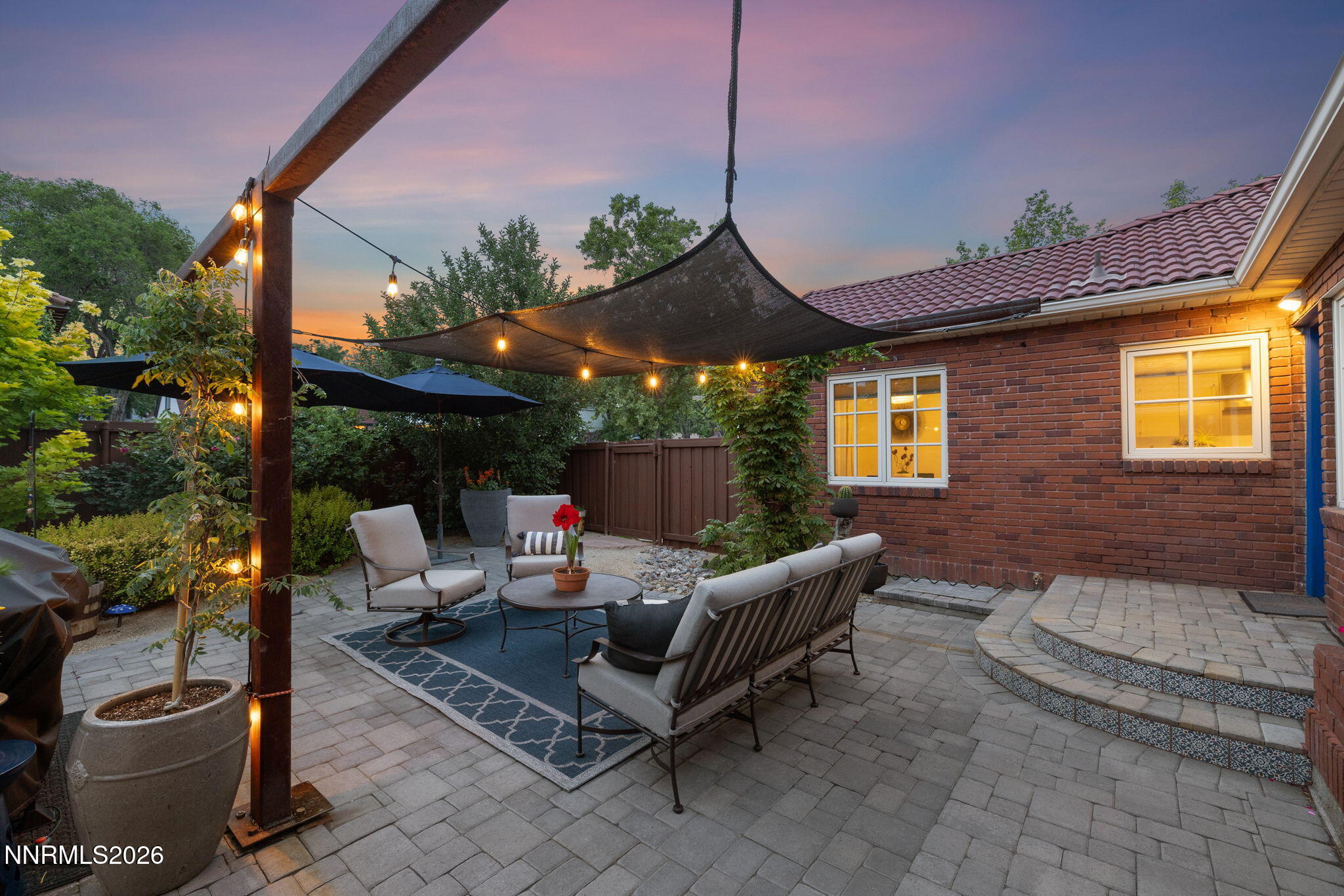 210 Bret Harte Avenue Reno, NV 89509 - Photo 35 of 40 a outdoor space with patio the couches and a potted plant on the table