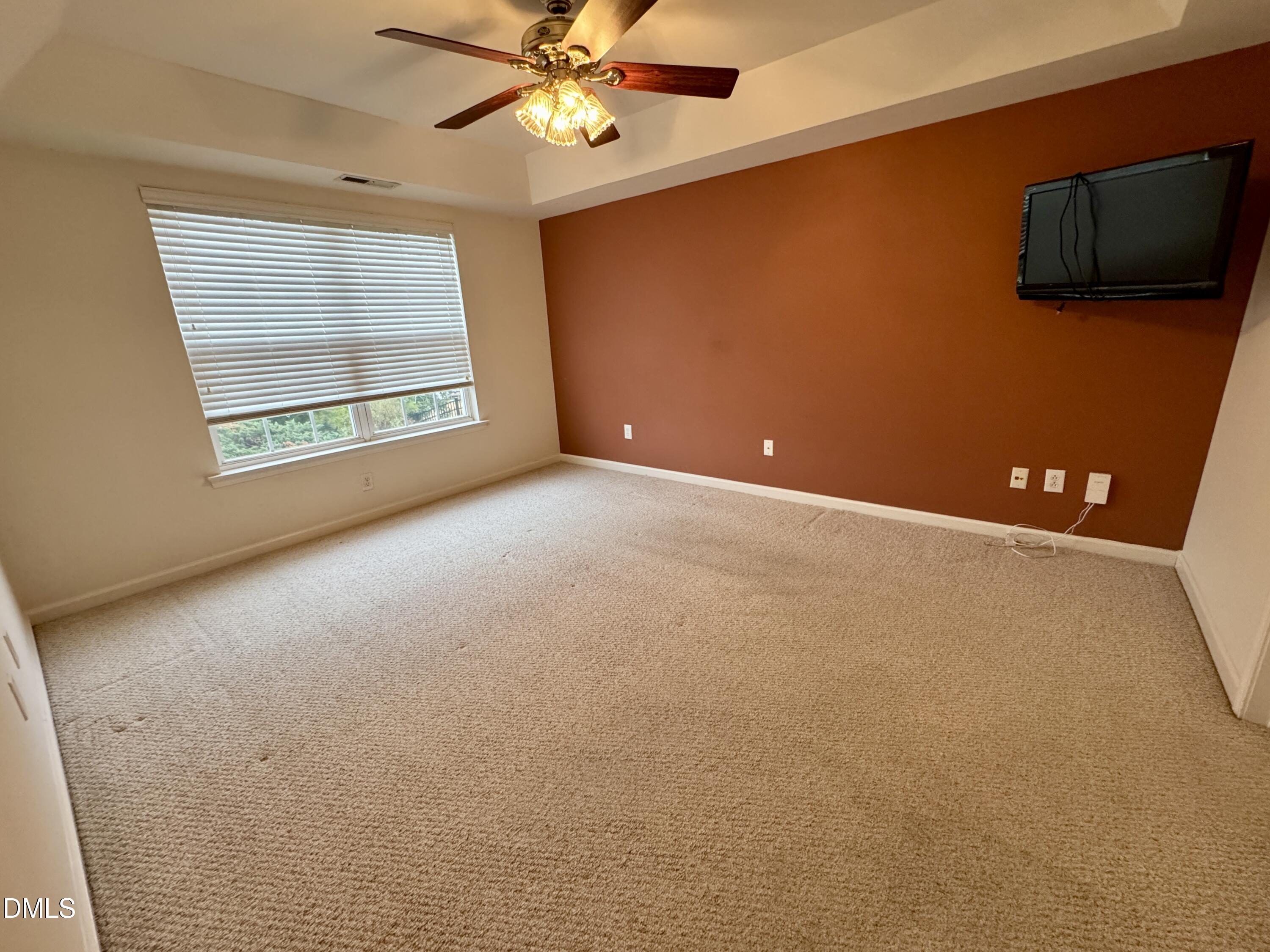 125 River Pearl Street Raleigh, NC 27603 - Photo 11 of 34 an empty room with windows and fan