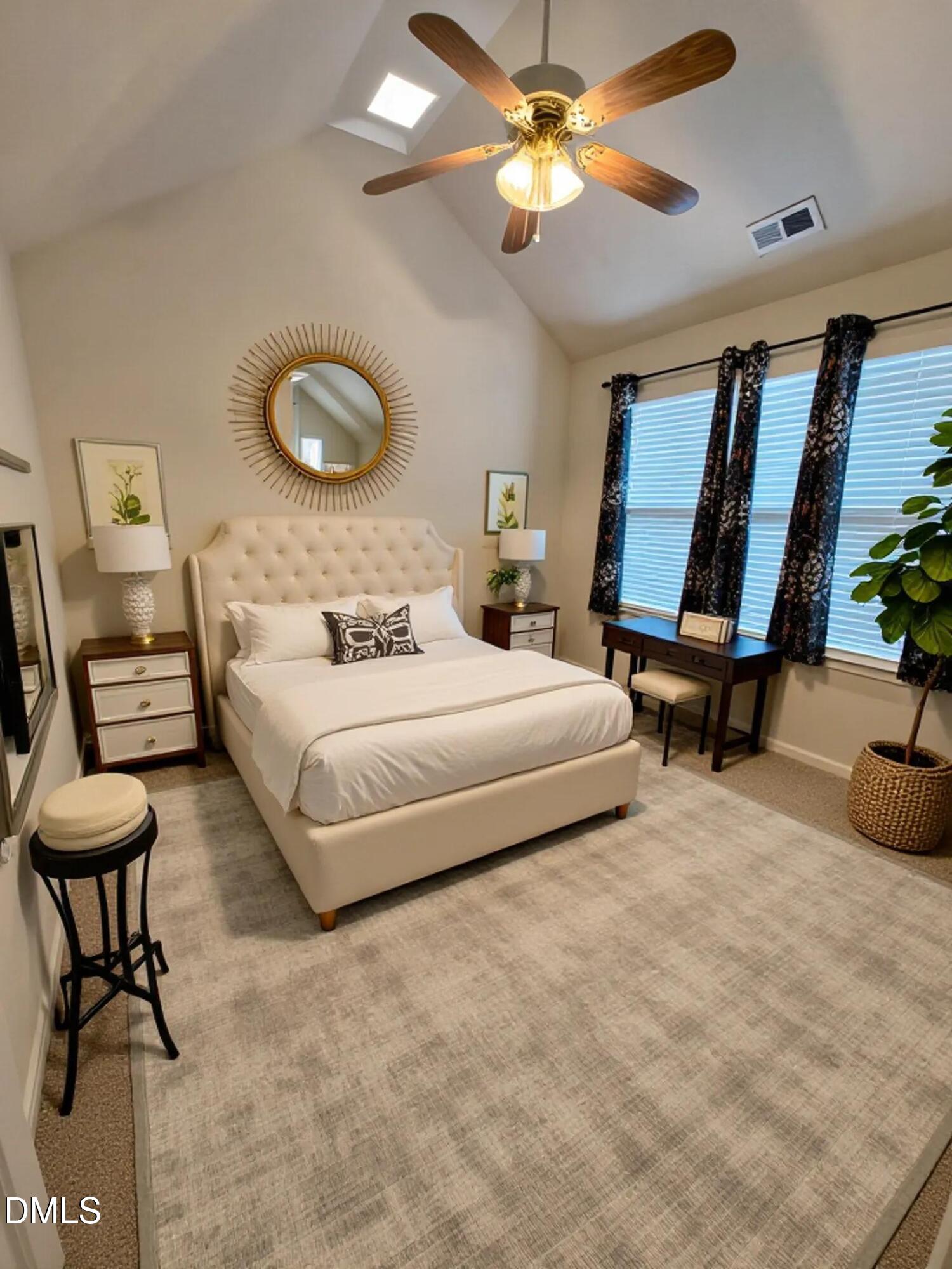 125 River Pearl Street Raleigh, NC 27603 - Photo 20 of 34 a bedroom with a bed and a chandelier