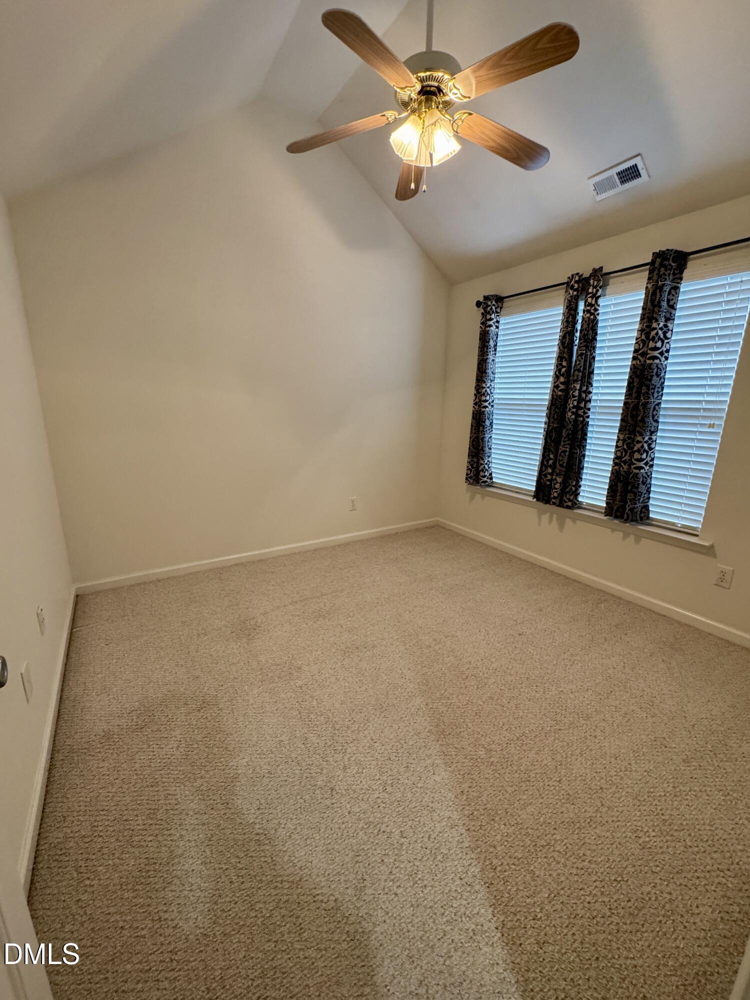 125 River Pearl Street Raleigh, NC 27603 - Photo 21 of 34 en empty room with windows and fan