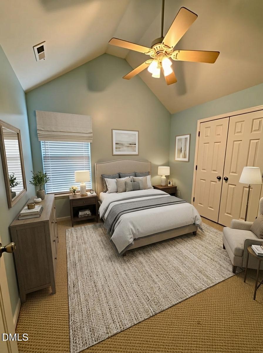 125 River Pearl Street Raleigh, NC 27603 - Photo 24 of 34 a bedroom with a bed and a flat tv screen on dresser