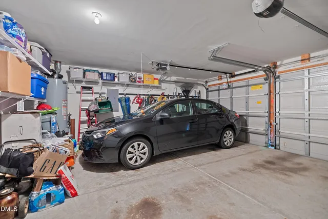 a view of a garage with parked cars