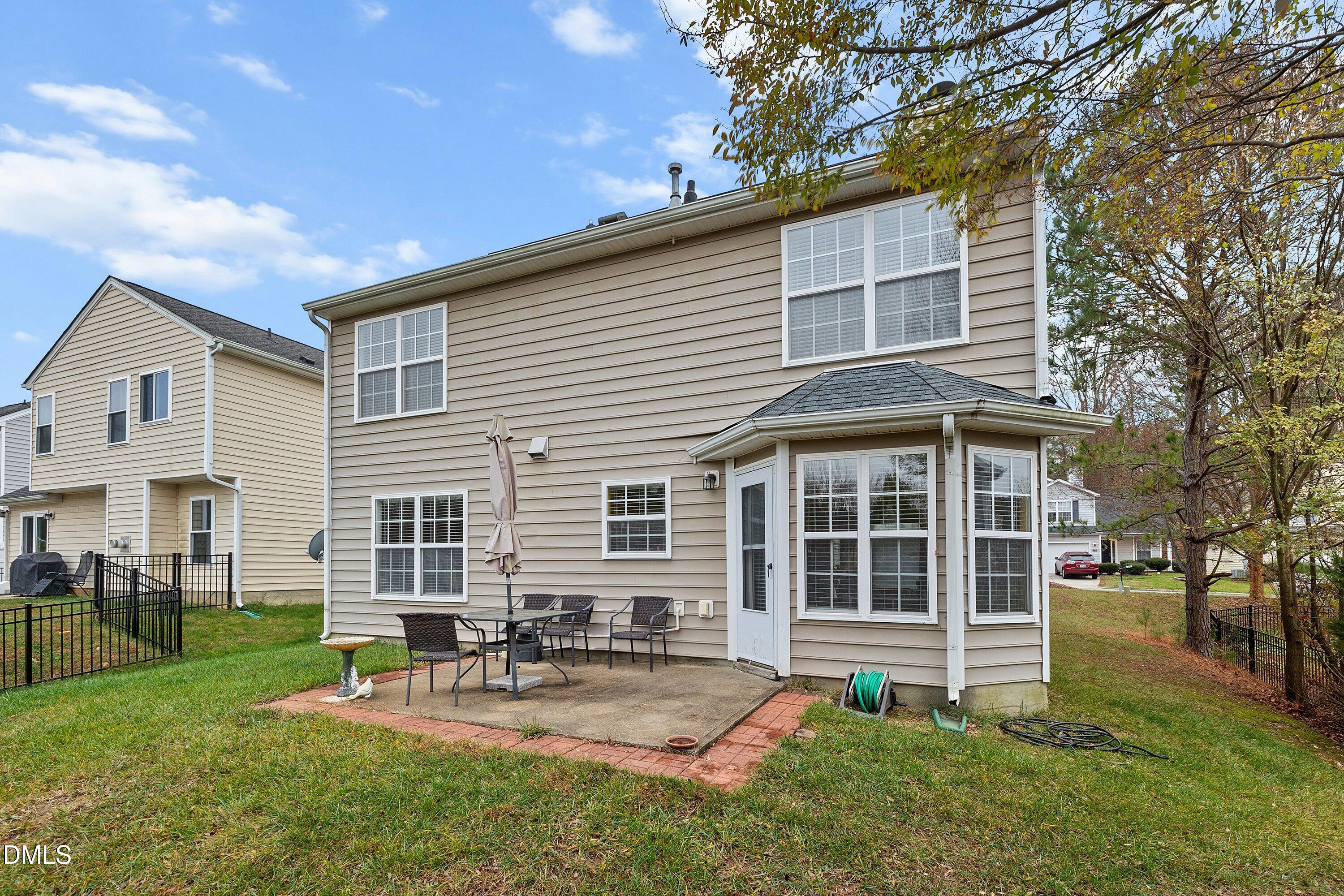 125 River Pearl Street Raleigh, NC 27603 - Photo 28 of 34 a view of a house with a yard and sitting area