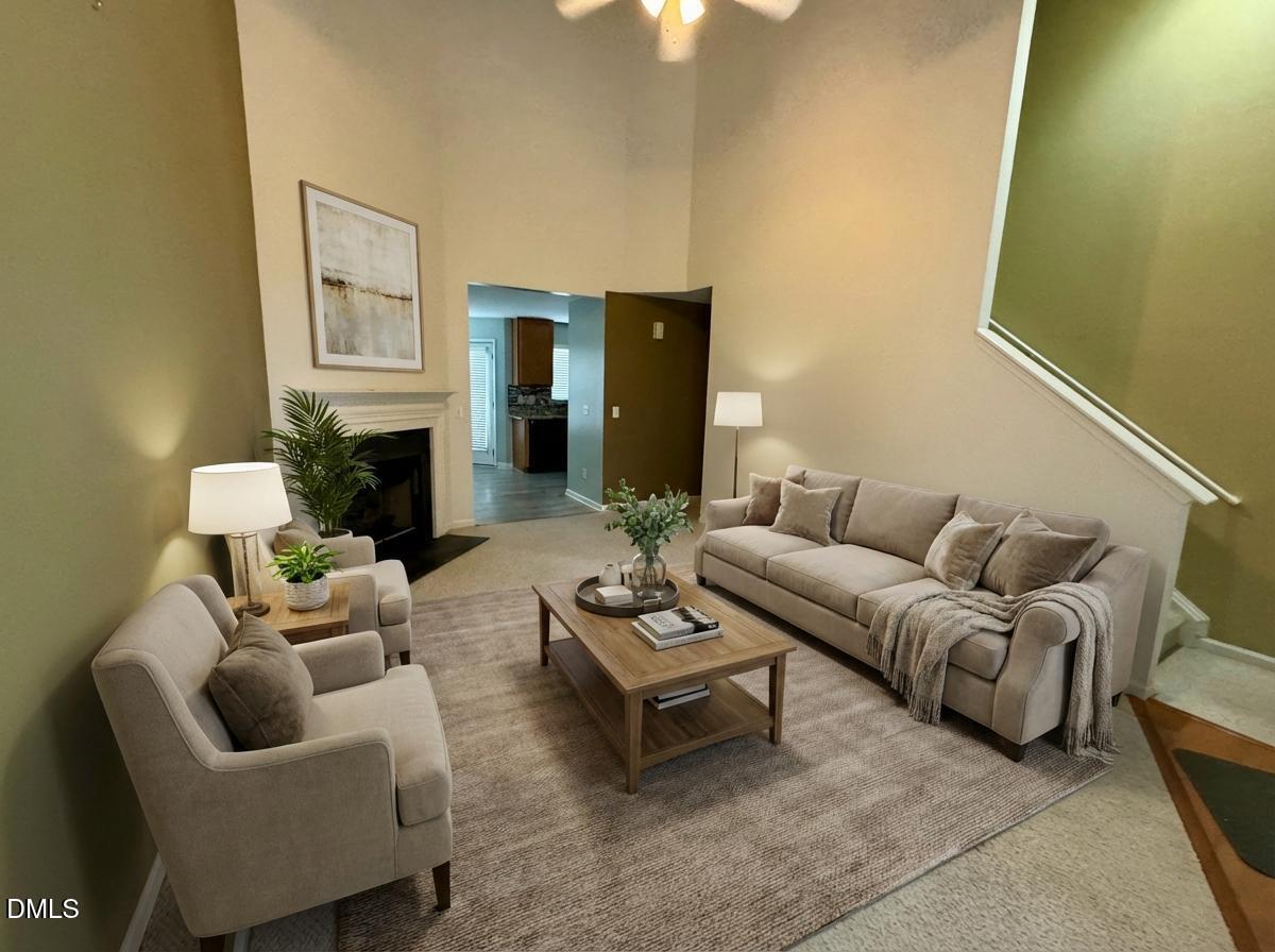 125 River Pearl Street Raleigh, NC 27603 - Photo 3 of 34 a living room with furniture fireplace and a table