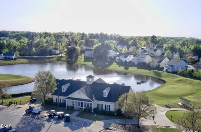 an aerial view of a house with lake view