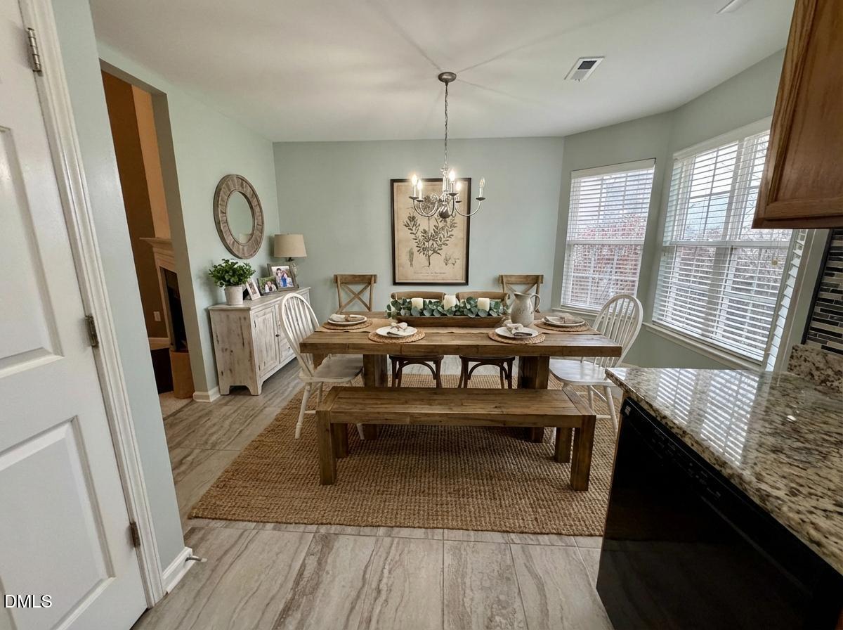 125 River Pearl Street Raleigh, NC 27603 - Photo 6 of 34 a view of a livingroom with furniture window and wooden floor