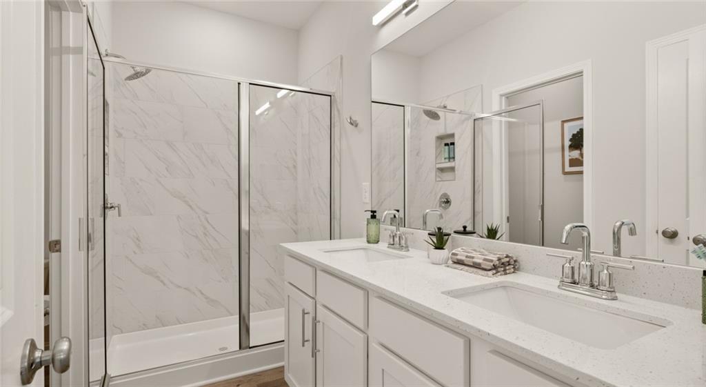 100 Rosemoore Drive Covington, GA 30014 - Photo 18 of 41 a bathroom with double sink and a mirror