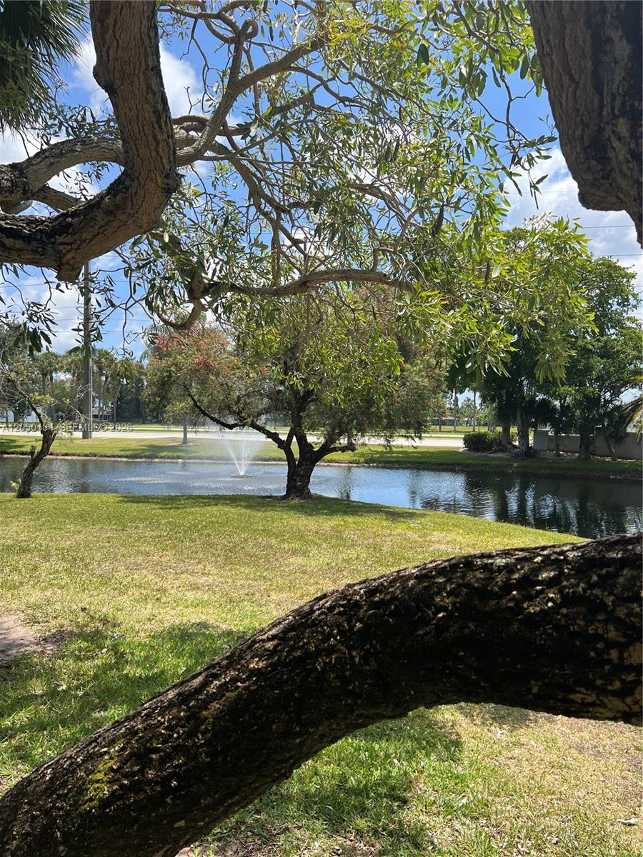 951 Lyons Road, Unit 6104 Coconut Creek, FL 33063 - Photo 13 of 18 a view of a lake with a lake