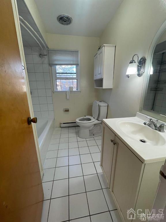 a bathroom with a sink a toilet a mirror and window